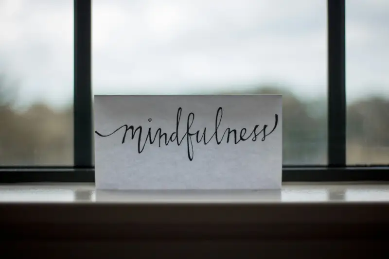 Employee practicing mindfulness at work to improve focus and reduce stress