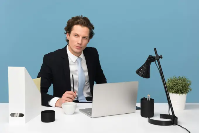 Professional organizing daily tasks in his desk